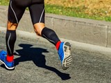 man running with compression socks